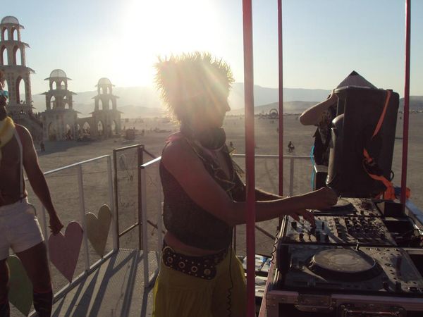 Jen Woolfe DJing at Burning Man at sunset