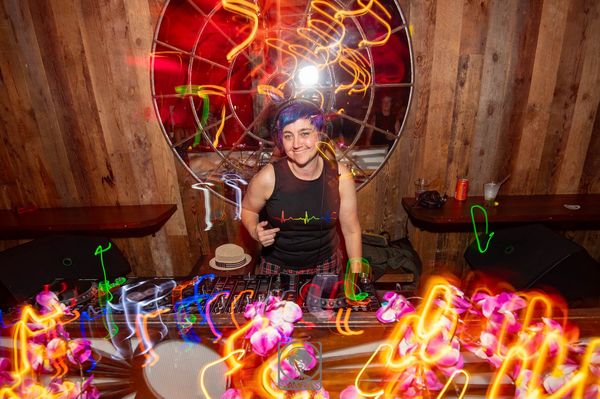 Jen Woolfe at the decks with Erin, surrounded by light trails